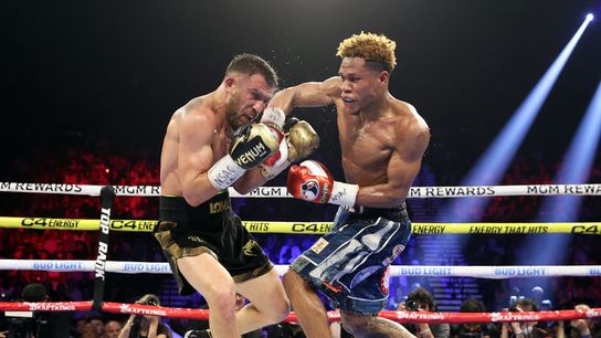 Vasiliy Lomachenko (L) battled Devin Haney in a 2023 lightweight title bout.