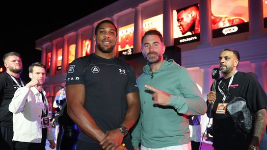 Anthony Joshua and promoter Eddie Hearn pose during the arrival ceremony Monday in Riyadh, Saudi Arabia.