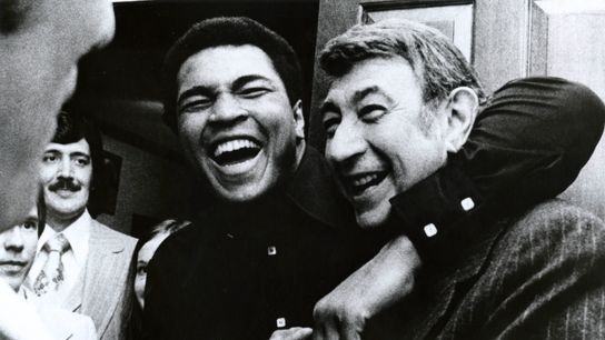 Howard Cosell (R) became a legend for his boxing play-by-play in many Muhammad Ali (L) bouts. Howard Cosell (R) became a legend for his boxing play-by-play in many Muhammad Ali (L) bouts.