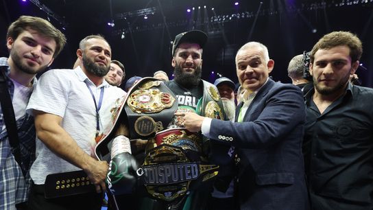 Undisputed light heavyweight champion Artur Beterbiev displays all of his belts.