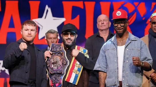 Turki Alalshikh holds the belts at stake as Canelo Alvarez (L) and William Scull pose for photographers/