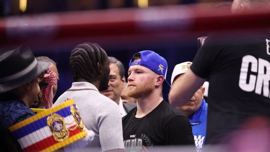 Terence Crawford (L) and Canelo Alvarez square off.