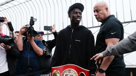 Richardson Hitchins shows off his IBF junior welterweight belt.