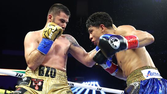 Eric Bazinyan (L) and Jaime Munguia battle during their super middleweight bout Friday at Desert Diamond Arena in Glendale, Ariz.
