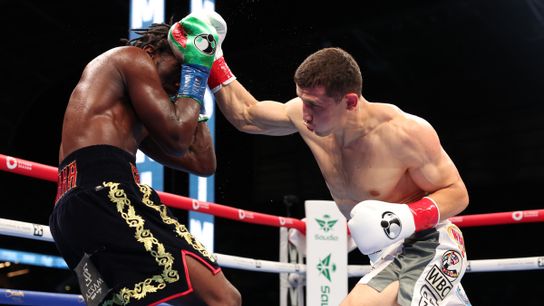 Israil Madrimov (R) attacks Terence Crawford during their super welterweight title fight Saturday in Los Angeles.