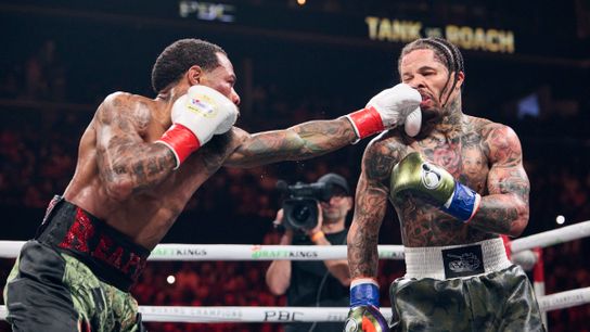 Lamont Roach (L) lands a jab on Gervonta Davis Saturday. 