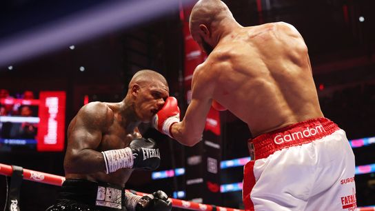 Chris Eubank Jr. (R) connects with a left to Conor Benn on Saturday.