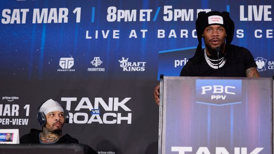 Tank Davis (L) listens as Lamont Roach speaks.