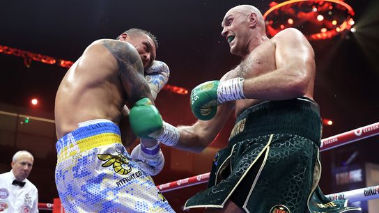 Oleksandr Usyk (L) and Tyson Fury battle in their May 18 bout for the undisputed heavyweight championship.