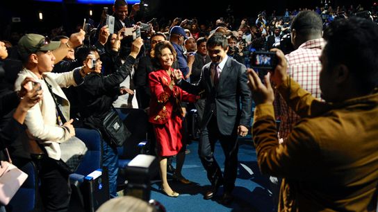 Manny Pacquiao arrives at the first news conference for his 2015 bout with Floyd Mayweather. Because the fight was so big, the press conference was a major event.