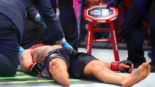 Justin Gaethje is out cold and is attended to by Nevada Athletic Commission doctors following his loss to Max Holloway at UFC 300.