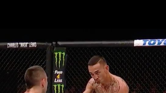 Max Holloway (R) challenges Ricardo Lamas to slug it out in the final 10 seconds of their bout at UFC 199.