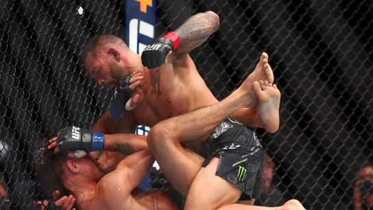 Dan Ige (top) punches Diego Lopes after taking the fight on three hours' notice Saturday.