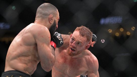 Jack Della Maddalena dodges a left hand Saturday from Belal Muhammad in their UFC welterweight title bout in Montreal.