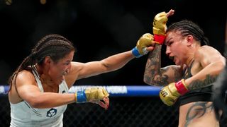 UFC 307: Julianna Peña regains women's bantamweight title in a squeaker over Raquel Pennington (UFC). Photo by Stephen R. Sylvanie/Imagn Images