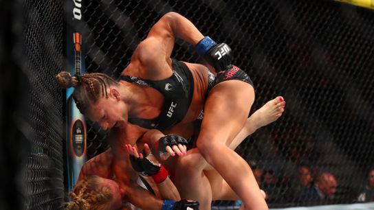 Kayla Harrison delivers ground-and-pound to Holly Holm Saturday in their bout at UFC 300 in Las Vegas.