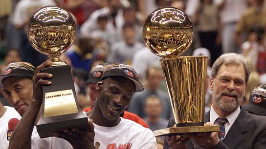 Michael Jordan (L) didn't need a sixth NBA title to certify his greatness.