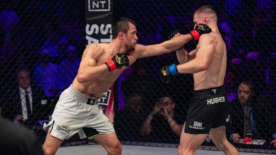 Usman Nurmagomedov (L) retained his Bellator lightweight title Saturday via majority decision over Paul Hughes.