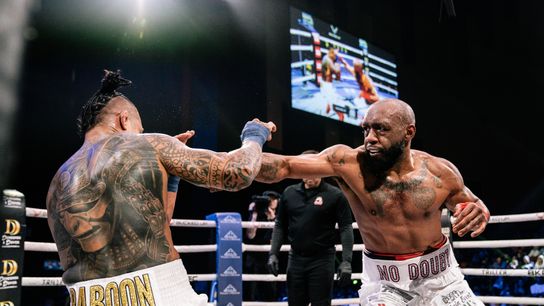 Austin Trout (R) lands a jab on Luis Palomino en route to winning the BKFC welterweight title.